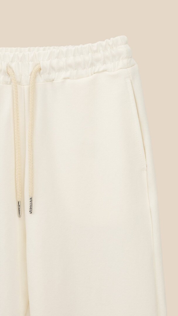 Спортивні штани однотонні для дівчинки LAWA GBC02330 152 см Молочний shop (2000999470998)  Фото №0